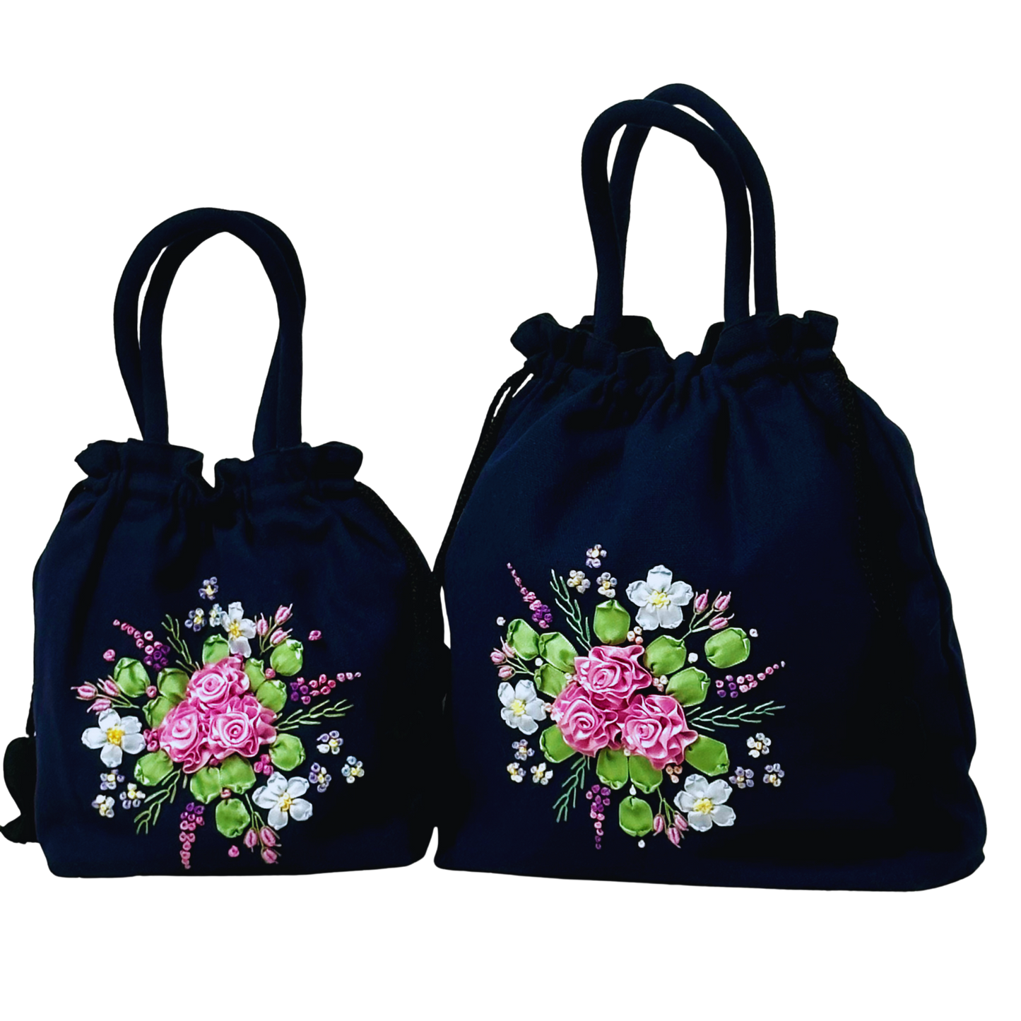 Ribbon embroidery with light pink roses on 2 dark blue drawstring pouch bags.