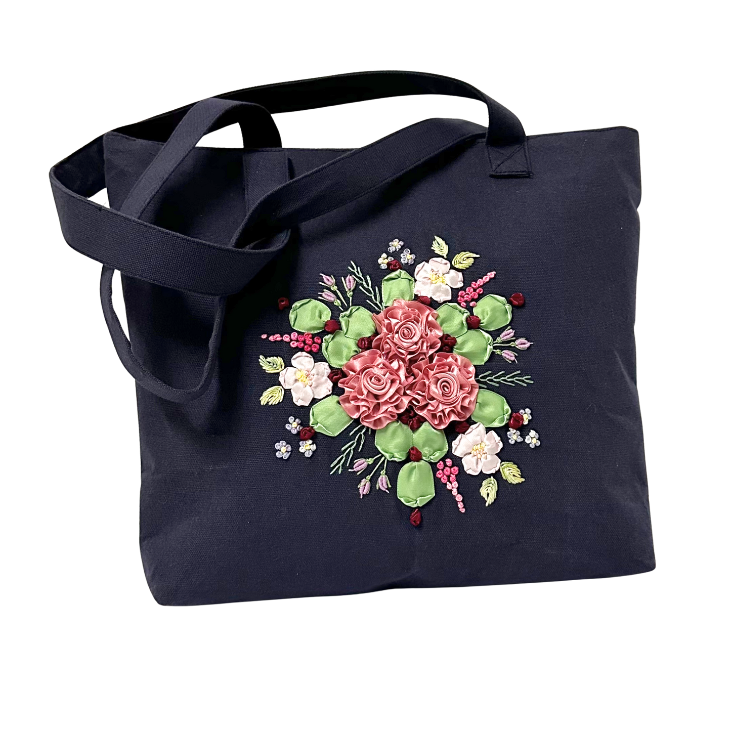 Ribbon embroidered  roses on a small dark blue tote bag