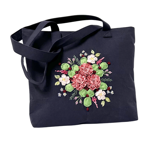 Ribbon embroidered  roses on a small dark blue tote bag